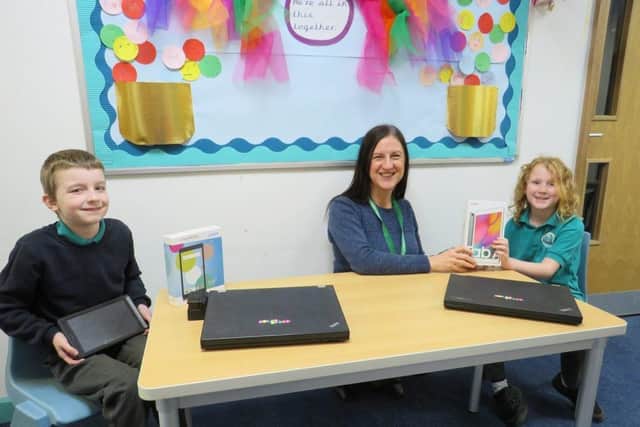 Manor Infant School headteacher Helen Castle welcomes the delivery of the digital devices.