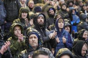 Pompey fans had to endure awful weather conditons for their New Year’s Day meeting with Swansea at Fratton Park..