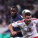 Gibraltar midfielder Liam Walker - a former Pompey player - challenges Dayot Upamecano in a 14-0 victory for France. Picture: FRANCK FIFE/AFP via Getty Images.