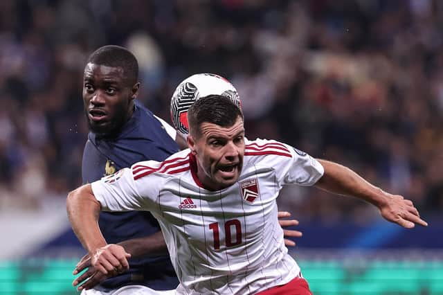 Gibraltar midfielder Liam Walker - a former Pompey player - challenges Dayot Upamecano in a 14-0 victory for France. Picture: FRANCK FIFE/AFP via Getty Images.