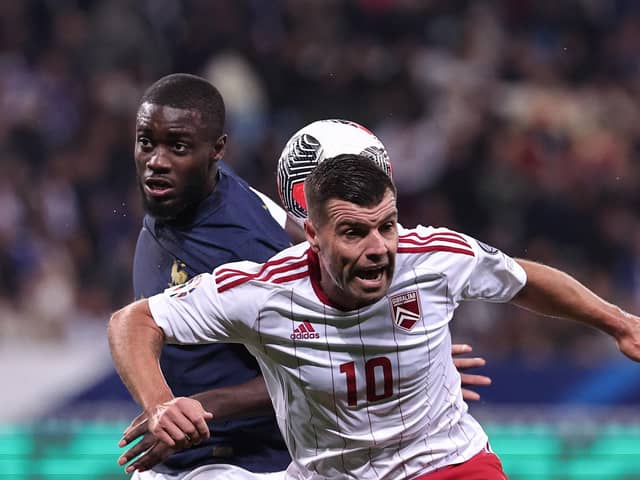 Gibraltar midfielder Liam Walker - a former Pompey player - challenges Dayot Upamecano in a 14-0 victory for France. Picture: FRANCK FIFE/AFP via Getty Images.