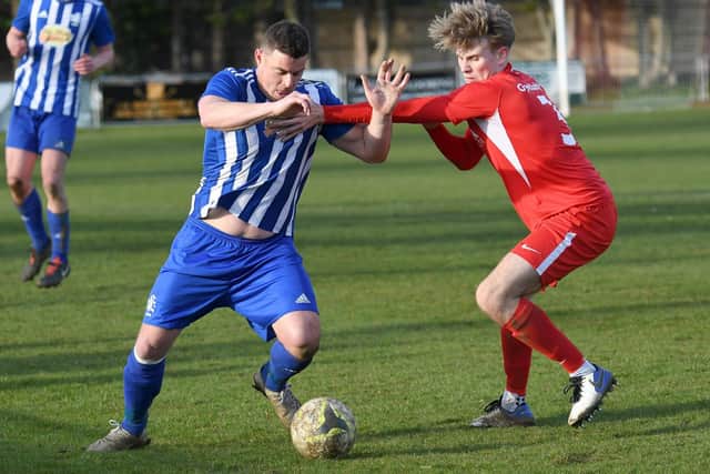 Greg Peel, left, in action for Shaftesbury at former club Horndean last season. Picture: Neil Marshall