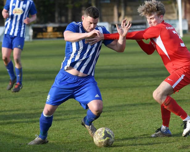 Greg Peel, left, in action for Shaftesbury at former club Horndean last season. Picture: Neil Marshall