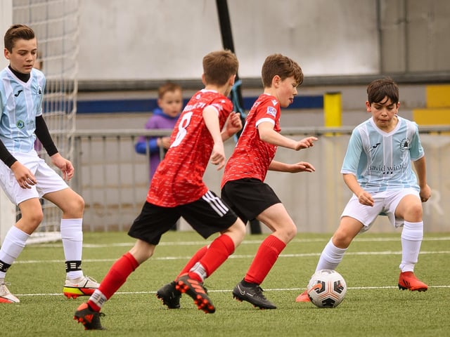 Action from the Portsmouth Youth League Geldard Invitation Cup final between Jubilee 77 U13s and Castle United U13s (light blue and white kit). Picture: Keith Woodland (190321-652)