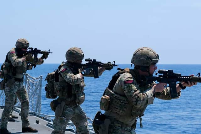 Royal Marines of 42 Commando carry out a live shoot on HMS Kent.