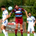 Andreas Robinson (white shirt, left) scored Gosport's opening goal in last night's FA Cup win against Hamworthy. Picture by Tom Phillips