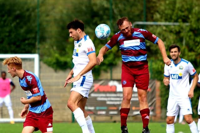 Andreas Robinson (white shirt, left) scored Gosport's opening goal in last night's FA Cup win against Hamworthy. Picture by Tom Phillips