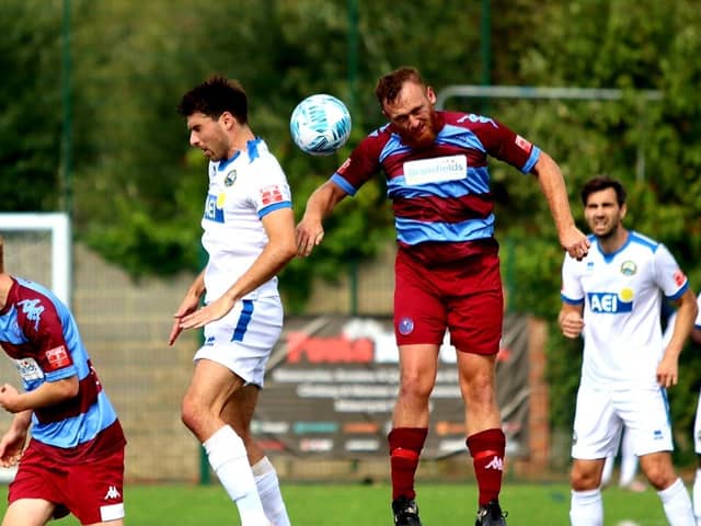 Andreas Robinson (white shirt, left) scored Gosport's opening goal in last night's FA Cup win against Hamworthy. Picture by Tom Phillips