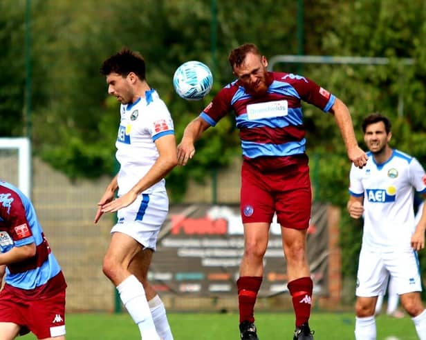 Andreas Robinson (white shirt, left) scored Gosport's opening goal in last night's FA Cup win against Hamworthy. Picture by Tom Phillips