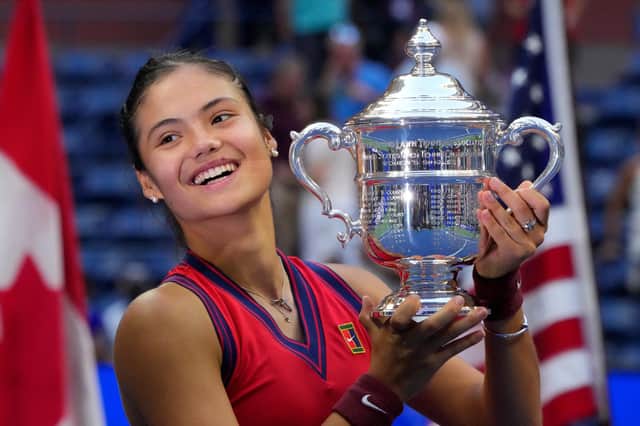 Emma Raducanu celebrates with the trophy after winning the 2021 US Open. Photo by TIMOTHY A. CLARY/AFP via Getty Images.