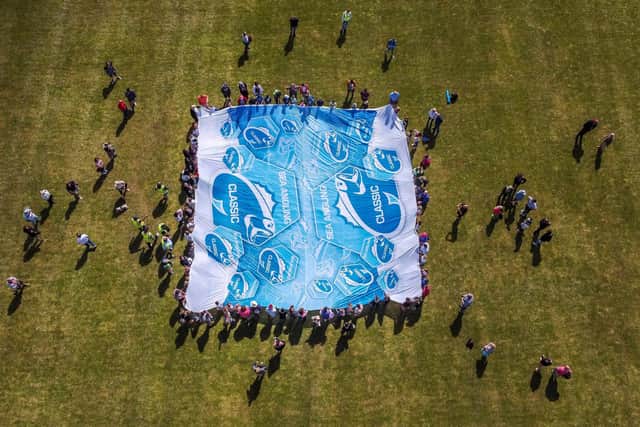 The giant flag to mark the start of the crabbing competition at Portchester Castle, seen from above. Picture: Ben Ford @broadcasterben  @seaanglingclassic (280522)