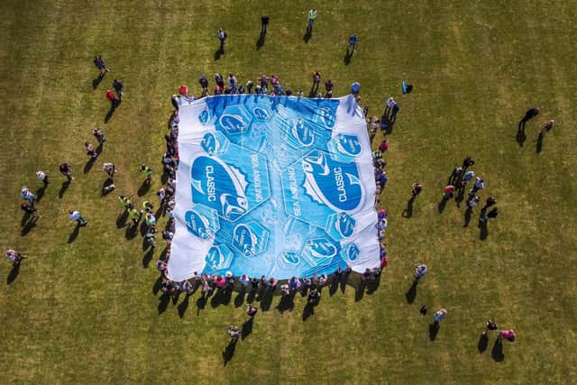 The giant flag to mark the start of the crabbing competition at Portchester Castle, seen from above. Picture: Ben Ford @broadcasterben @seaanglingclassic (280522)