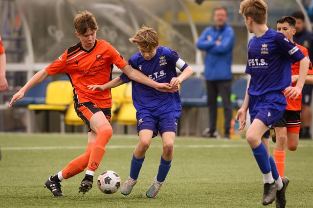 Action from the Portsmouth Youth League Stuart Madigan Cup final between Baffins Milton Rovers Vipers U14s (all blue kit) and AFC Portchester Vikings U14s (orange and black kit). Picture: Keith Woodland (190321-378)