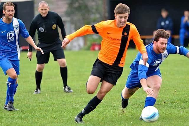 Joe Benn (orange) has netted 22 goals already for Littlehampton this season. Picture by Stephen Goodger