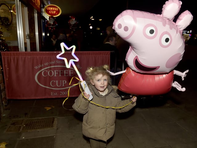 Martha Williams, 3, from Portchester, grabbed herself a Peppa Pig balloon.  Picture: Sarah Standing (291124-6765)