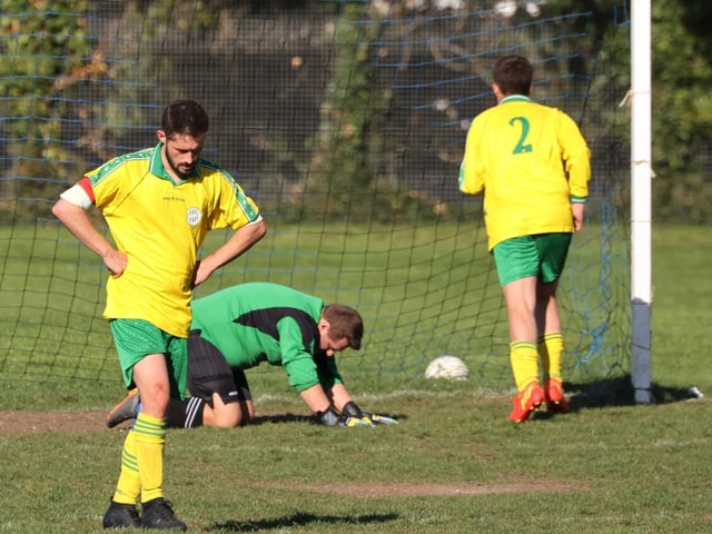 Wickham concede once again during their 8-3 defeat. Picture by Kevin Shipp
