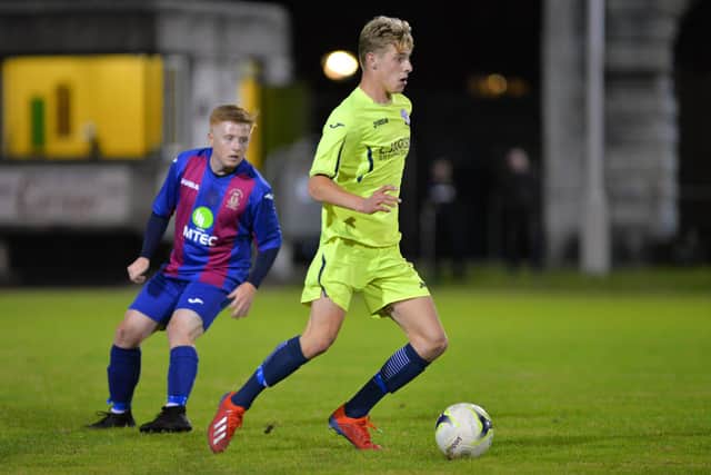 Alfie Lis on the ball for Horndean in their win at US Portsmouth. Picture: Martyn White
