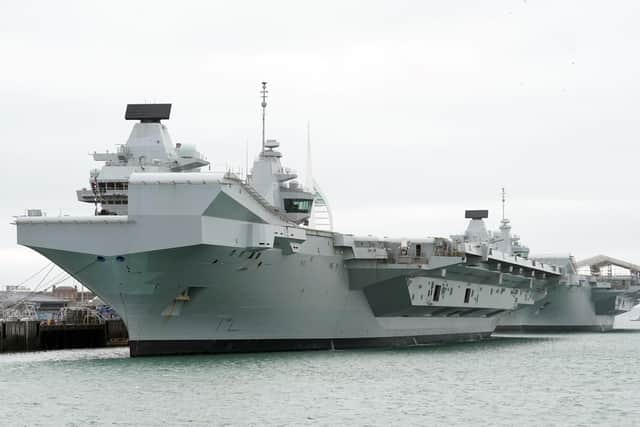 HMS Queen Elizabeth's departure from Portsmouth was delayed today. She is due to sail to Rosyth in Scotland to fix a mechanical fault discovered in February, before she was due to join Nato allies on Exercise Steadfast Defender.