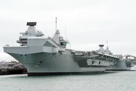 HMS Queen Elizabeth's departure from Portsmouth was delayed today. She is due to sail to Rosyth in Scotland to fix a mechanical fault discovered in February, before she was due to join Nato allies on Exercise Steadfast Defender.