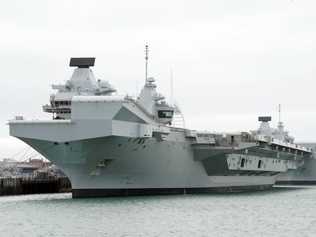 HMS Queen Elizabeth's departure from Portsmouth was delayed today. She is due to sail to Rosyth in Scotland to fix a mechanical fault discovered in February, before she was due to join Nato allies on Exercise Steadfast Defender.