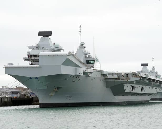 HMS Queen Elizabeth's departure from Portsmouth was delayed today. She is due to sail to Rosyth in Scotland to fix a mechanical fault discovered in February, before she was due to join Nato allies on Exercise Steadfast Defender.