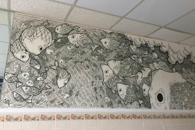 Vik Demjanova, 18 from Southsea, has been creating intricate murals on blank walls. Pictured: Vik's latest mural in Ocean Fresh Fish and Chips