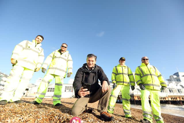 Steve Bomford photographs plastic waste on Southsea beach with members of the Colas team, from left, Paul Fuller, Tony White, Robbie White and Keith Yarrow. Picture: Chris Moorhouse (150120-19)