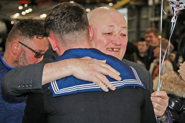 Able Seaman Rhys Zanetti got a big surprise for his 18th birthday on board HMS Prince of Wales – when his family sneaked on board to present him with a birthday cake. Pictured: Rhys' family arrives with the cake Photo: Royal Navy