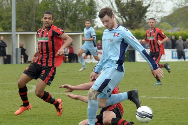 Joe Noakes (blue) made a remarkable playing comeback for Portchester against AFC Totton. Picture: Mick Young