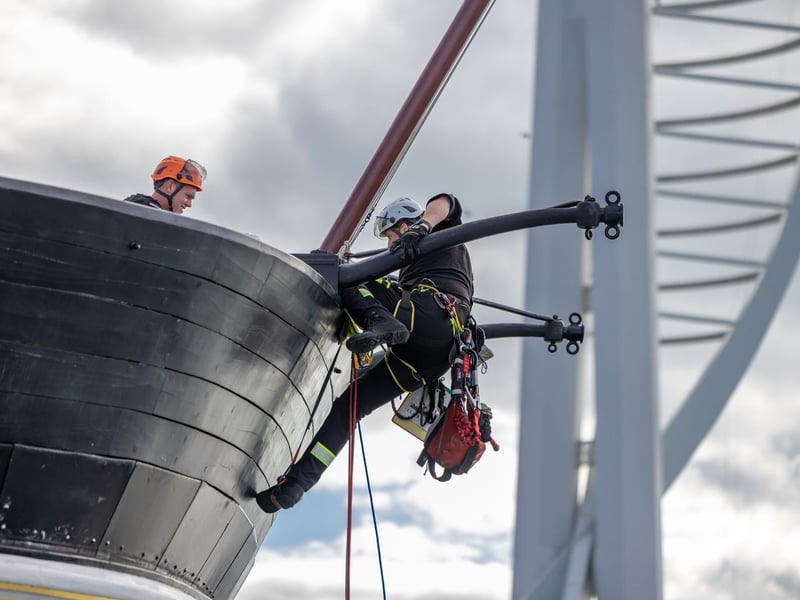 Firefighters practicing rescue from the sea, ascending by rope onto HMS Warrior during the UKRO event at Portsmouth Historic Dockyard. Picture: Mike Cooter (280924)