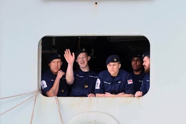 Sailors on HMS Queen Elizabeth as she returns to Portsmouth.
Picture: Sarah Standing (020720-5215)