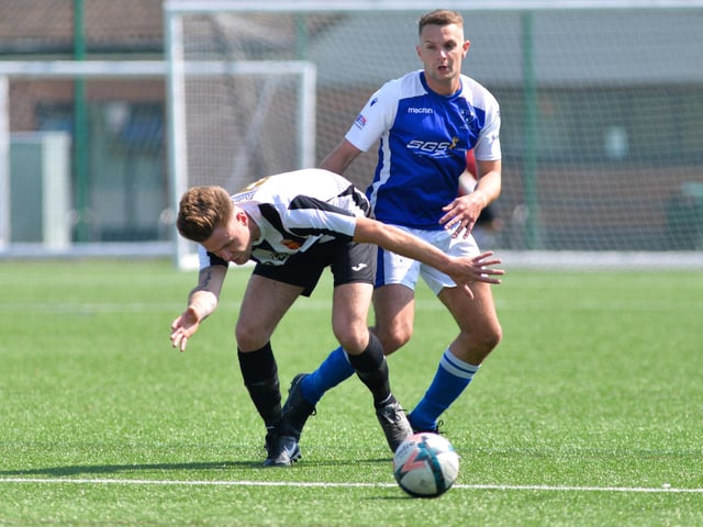 Denmead (blue) v Hayling. Picture by Martyn White