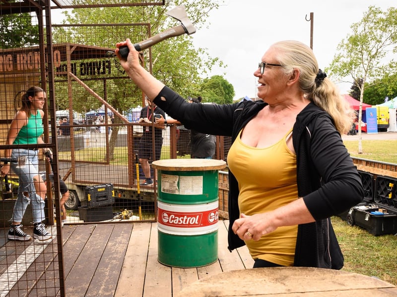 Shelia Tapper from Havant throws an axe on the flying iron stand