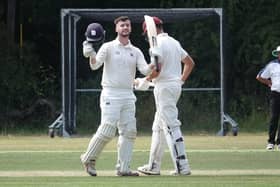 Ben Duggan celebrates  his century for Portsmouth at Calmore. Picture  by Martin Fisher.