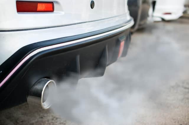 Car belching out fumes from its exhaust