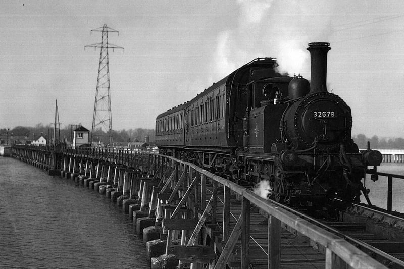 The Hayling Billy in her prime crossing Langstone trestle bridge.