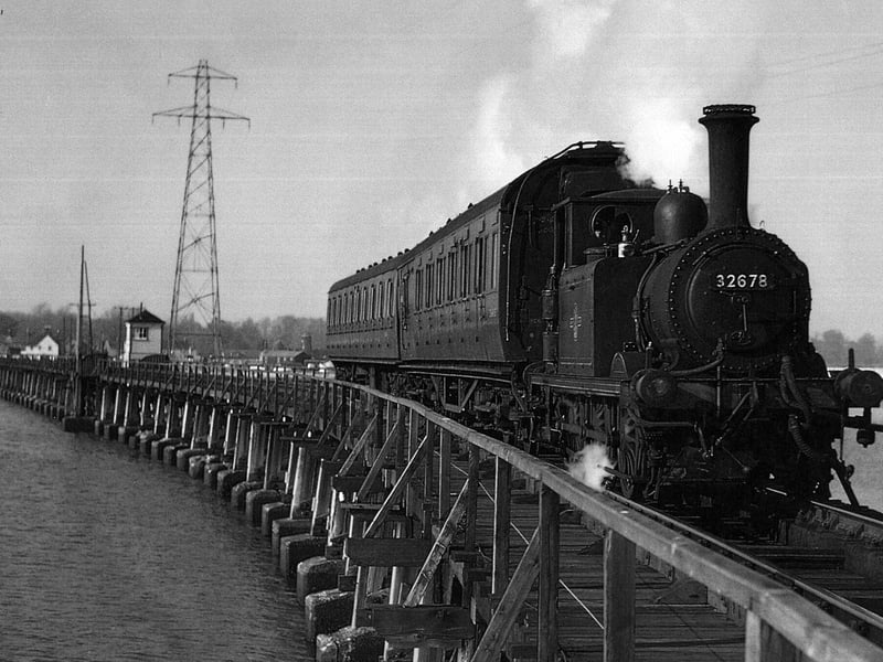 The Hayling Billy in her prime crossing Langstone trestle bridge.