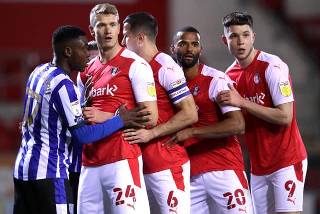 Former Pompey striker Michael Smith (left) and current Blues front man George Hirst on opposite sides of the Rotherham wall. (Photo by Alex Pantling/Getty Images)