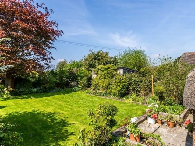 The listing says: "Thatchways is a delightful gem of a period property, full of lovely period features, including exposed timbering and huge fireplaces. Rooms are of a generous size and, in addition, an excellent annexe, with its own garden and separate entrance has been created which may be used independently or incorporated within the main accommodation, and has a more contemporary style."