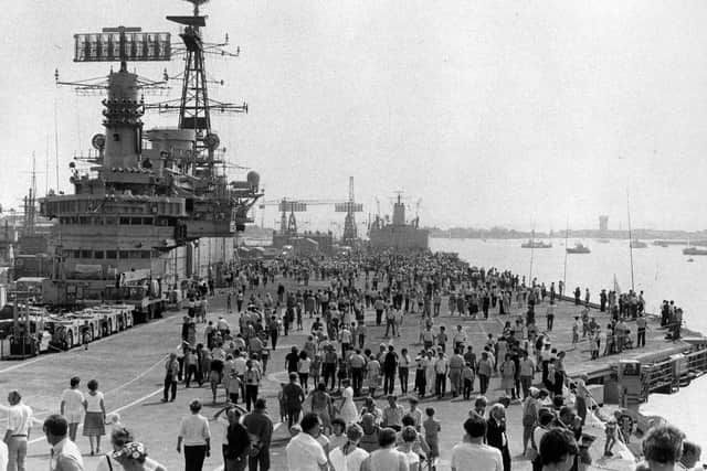 The flight deck of an aircraft carrier packed with visitors in 1983. The News PP4990