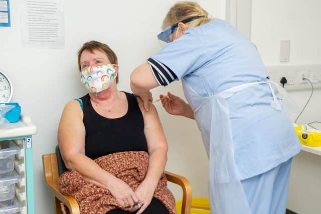 Wendy Peters giving Jackie Blake a vaccination jab at St James Hospital, Portsmouth on February 17. Picture: Habibur Rahman