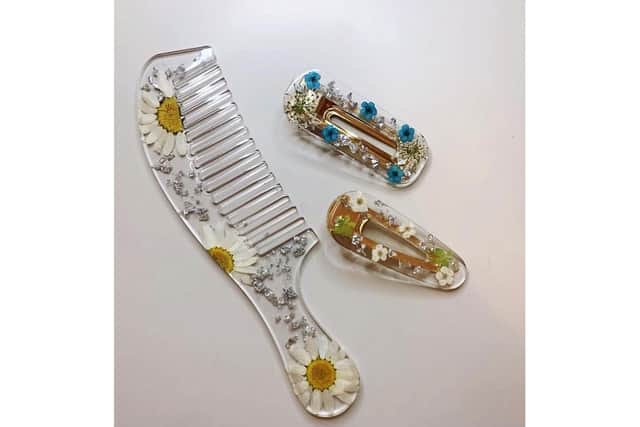 A resin comb and clips created by Jess for Wheelie Good Designs.
