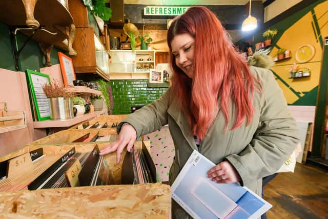 Pictured is: Evie Smith browses the records. Picture: Keith Woodland (220421-13)