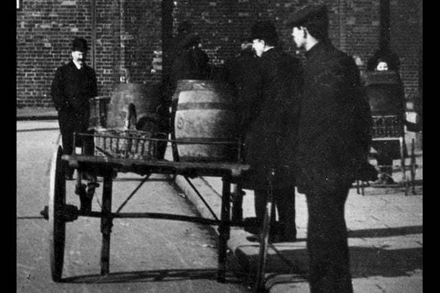 Barrels of beer sit on a cart ready for delivery to the pubs of Old Portsmouth around 1910. Picture: Costen.co.uk