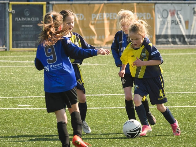 Gosport Borough (yellow/blue kit) lock horns with Clanfield. Picture: Keith Woodland (030621-35)