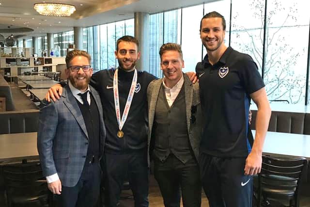 Brian Howard (second right) and business partner Phil Korklin with Christian Burgess and Ben Close following Pompey's Checkatrade Trophy final win at Wembley in March 2019