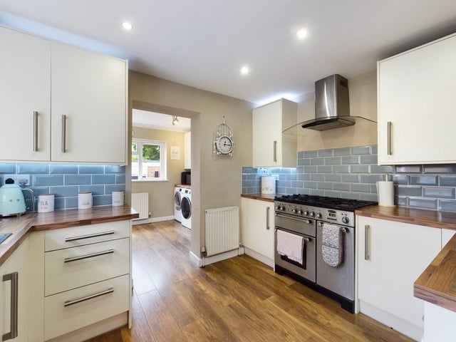 The kitchen with the utility room behind