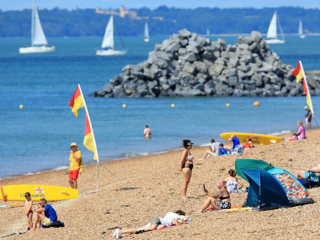 Groups gathered on the shoreline in Southsea to enjoy some sunbathing and swimming in the Solent.