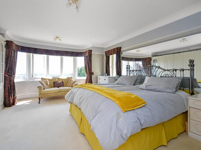 One of the bedrooms with plenty of windows