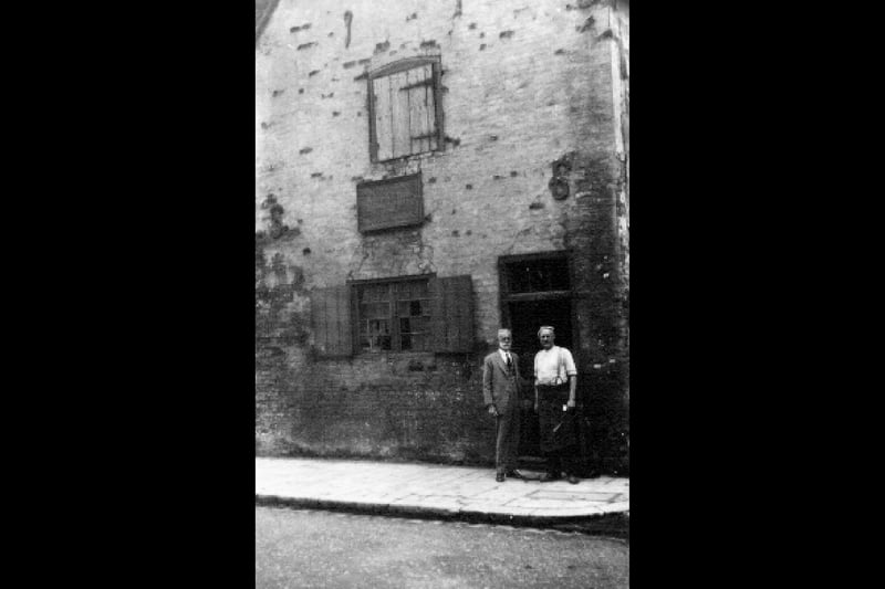 Alfred Baxter (right) in 1926 outside the blacksmiths shop in Old Portsmouth.